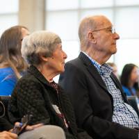 President Philomena V. Mantella sitting with Ellen and Robert Thompson.